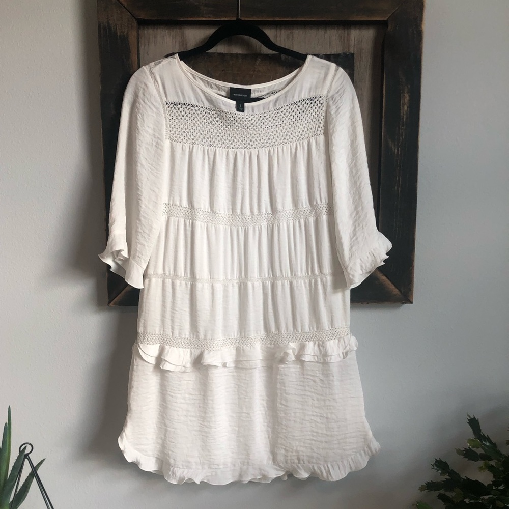 Cream ruffle shift dress.